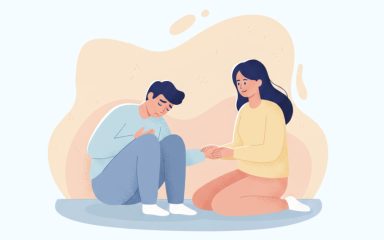 Zena pomaze muskarcu prilikom napada panike.